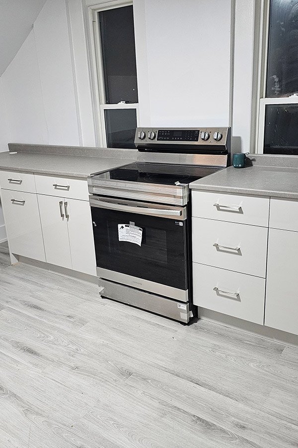 Dental Clinic Kitchen Cabinets in Owen Sound | High-Gloss Slab Doors