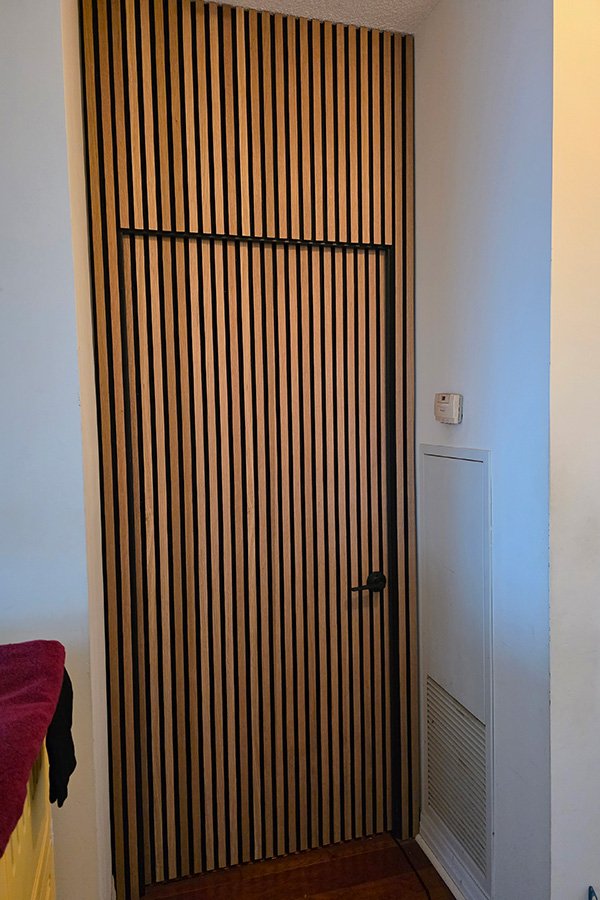 Luxury Wall Panelling in Mississauga – Fluted Panels, Marble Sheet & Acoustic Slats with Hidden Door